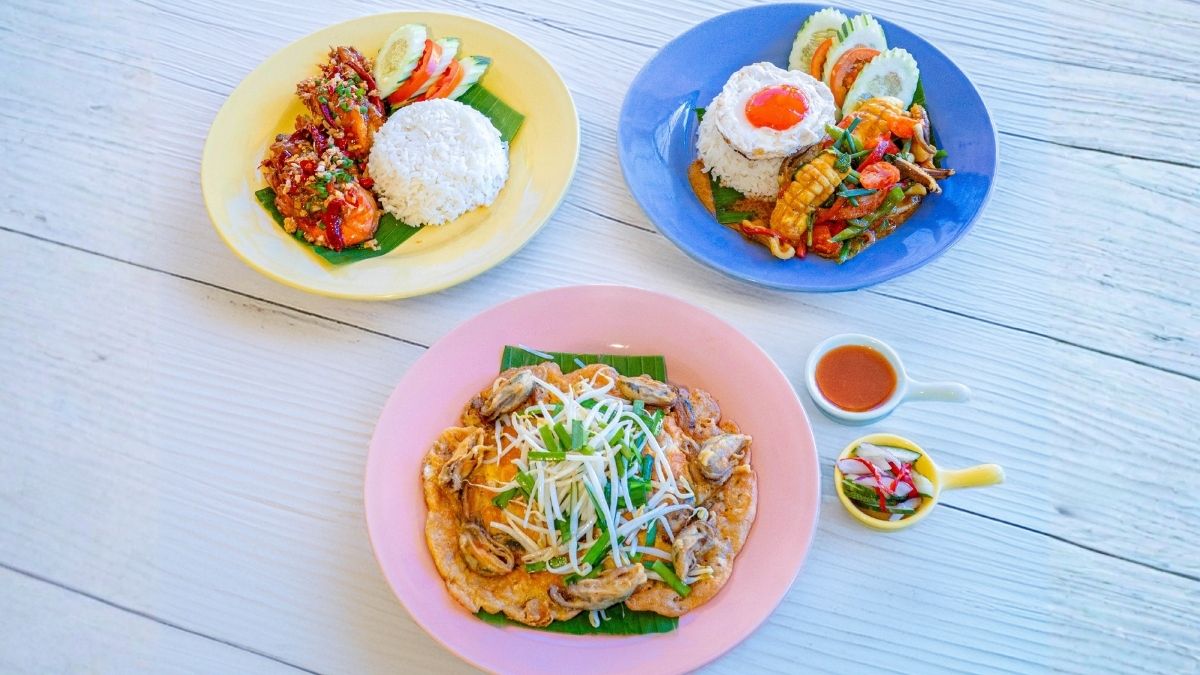 Savor Andaman-fresh seafood with bold local flavors—Pla Muek salted egg squid, crispy Hoy Thod and Goong Thod Kua Prik Glure, Phuket-style favorites.